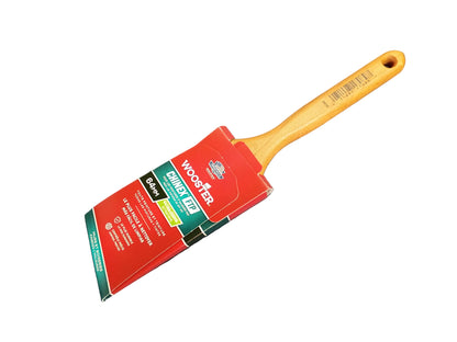 A Wooster FTP paint brush with a red and green cardboard label, with a white background.