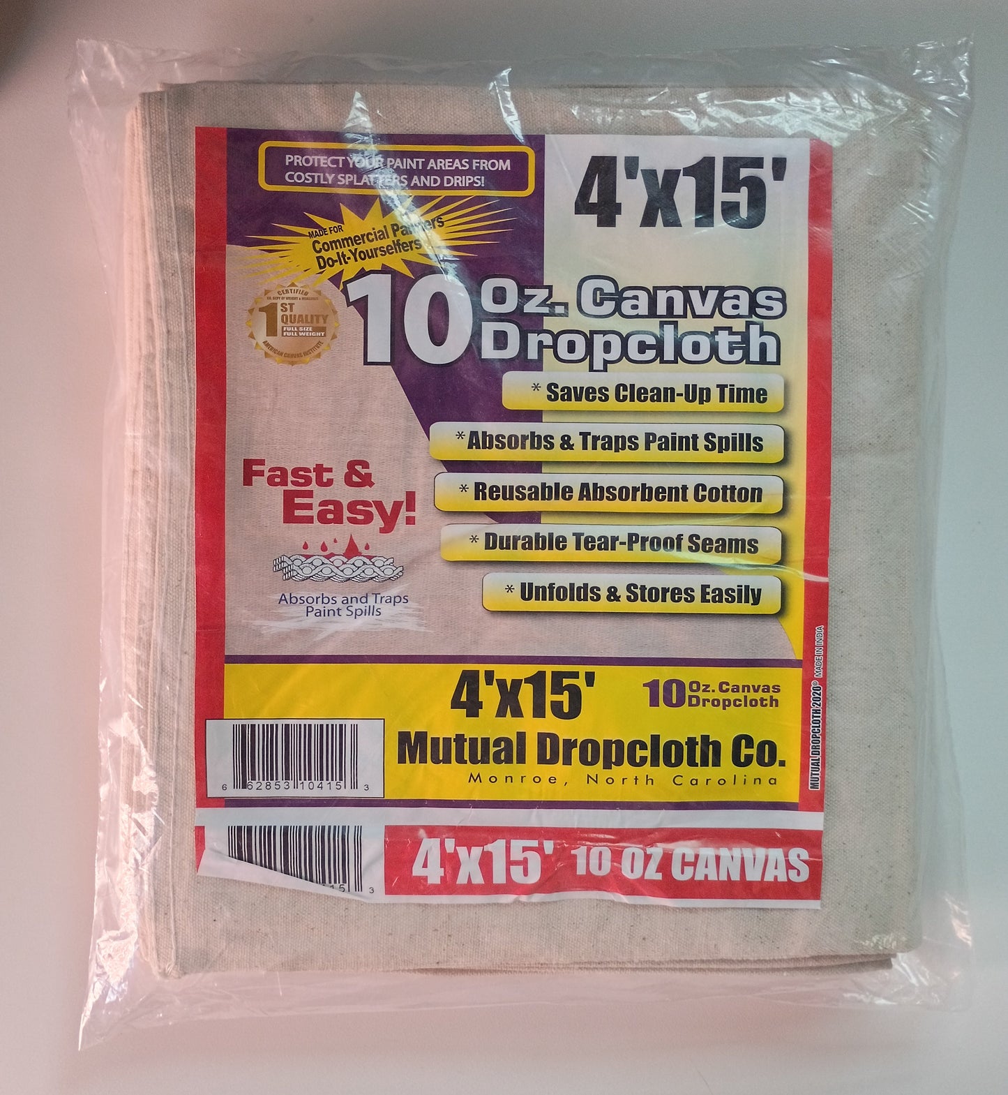 A pack of 10 sheets of Mutual Dropcloth Co. 4'x15' 10 oz canvas dropcloth, sealed in clear plastic packaging with a colorful paper label.