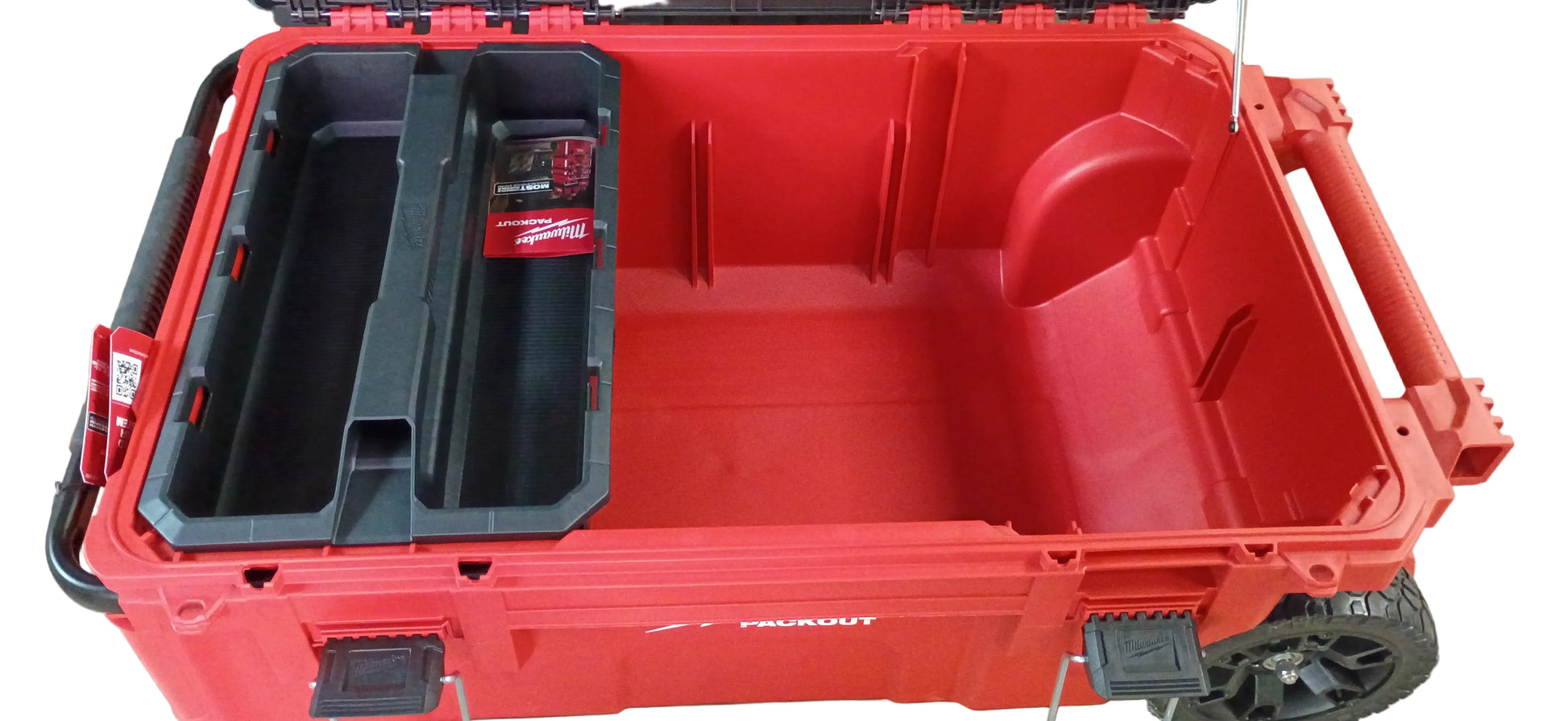 A red and black rugged Milwaukee rolling tool box with an open lid, shown on a white background. The case has molded interior compartments, including a black organizer tray on the left with a visible Milwaukee logo sticker.