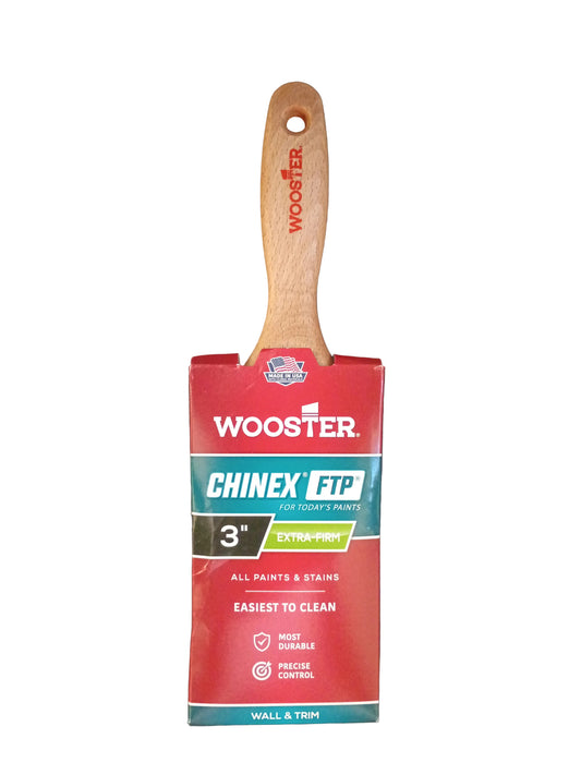 A 3-inch wooden paint brush with a red and teal Wooster Chinex-FTP handle wrap, shown against a dark gray textured background.